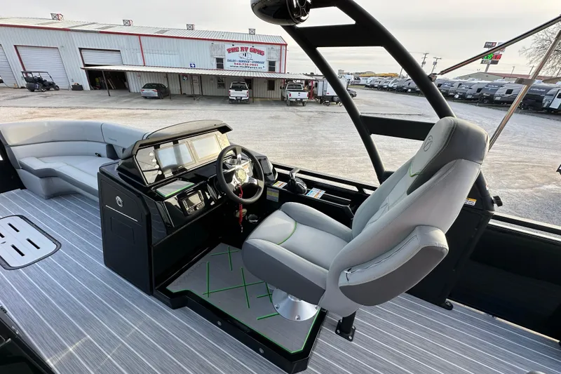 Slide: The Image of 2024 Veranda VX 25 DCVL boat interior with modern helm and seating. - 18