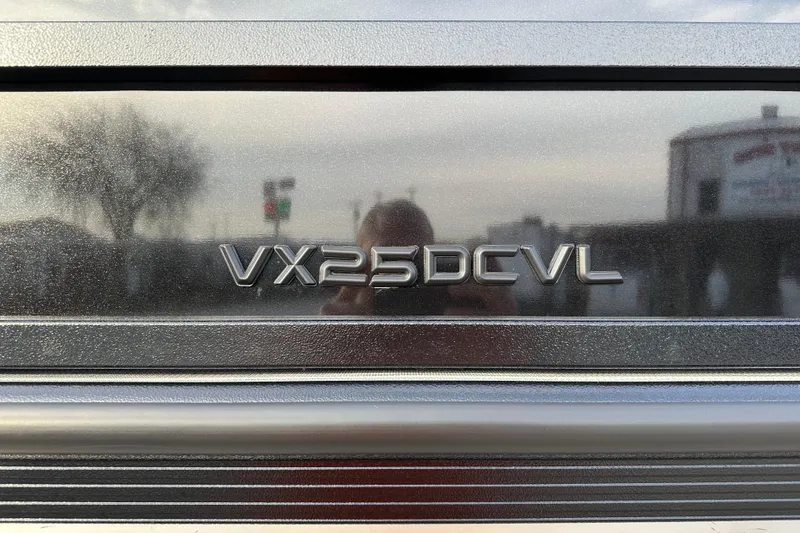 Slide: The Image of 2024 Veranda VX 25 DCVL logo on metallic surface. - 23