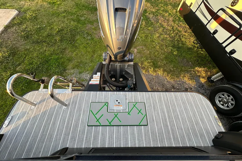 Slide: The Image of 2024 Veranda VX 25 DCVL boat with motor, viewed from above, on grass. - 24