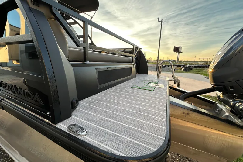 Slide: The Image of 2024 Veranda VX 25 DCVL pontoon boat deck with sleek design and powerful engine. - 25