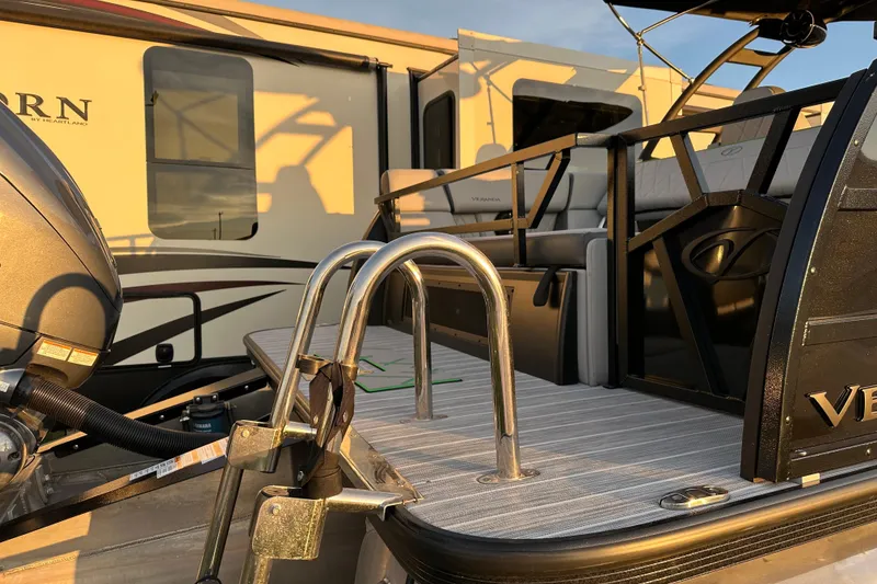 Slide: The Image of 2024 Veranda VX 25 DCVL pontoon boat with sleek design and modern features. - 26