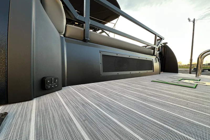 Slide: The Image of 2024 Veranda VX 25 DCVL boat interior with sleek seating and modern audio system. - 28