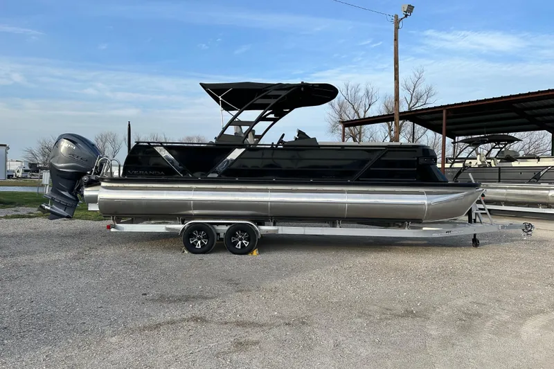 Slide: The Image of 2024 Veranda VX 25 DCVL pontoon boat with Yamaha outboard motor on trailer. - 3