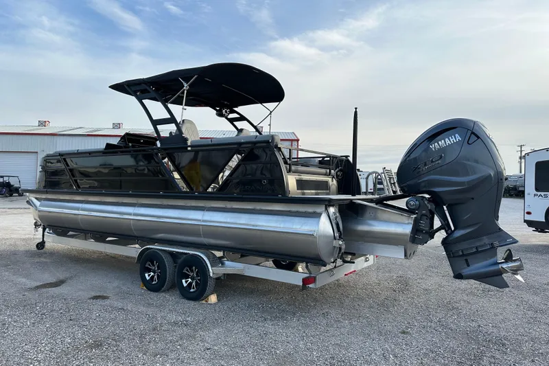 Slide: The Image of 2024 Veranda VX 25 DCVL pontoon boat with Yamaha outboard motor on trailer. - 5