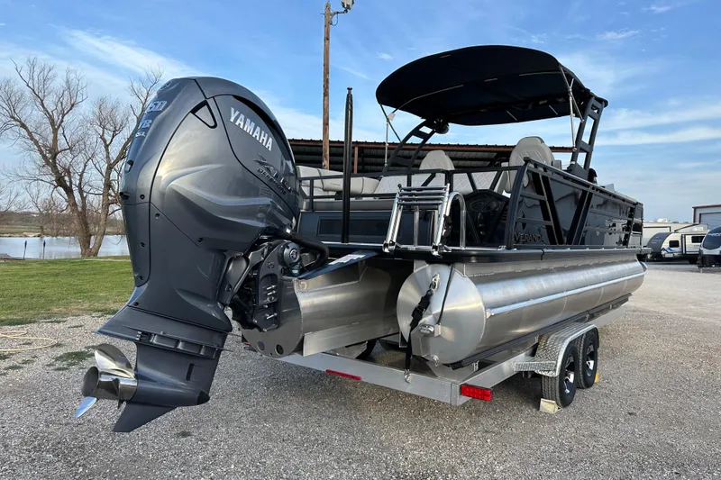 Slide: The Image of 2024 Veranda VX 25 DCVL pontoon boat with Yamaha outboard motor on trailer. - 7