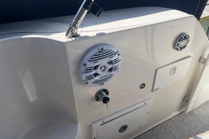 Slide: The Image of 2007 Rinker 320 Express Cruiser interior with Kenwood speaker and control panel. - 15