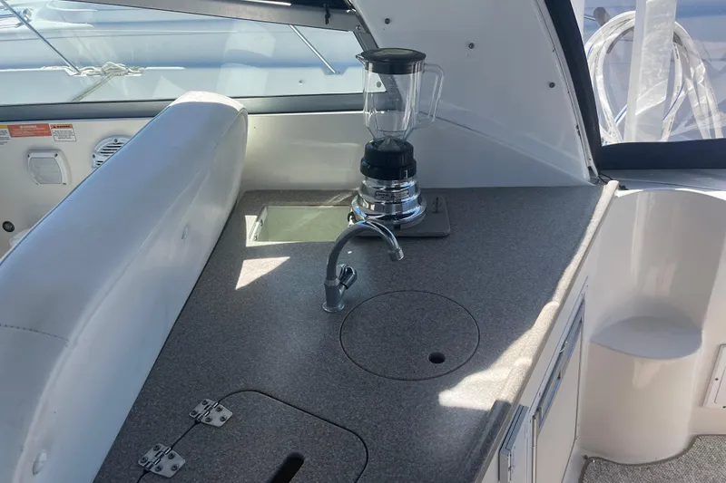 Slide: The Image of 2007 Rinker 320 Express Cruiser interior with countertop, sink, and blender. - 19