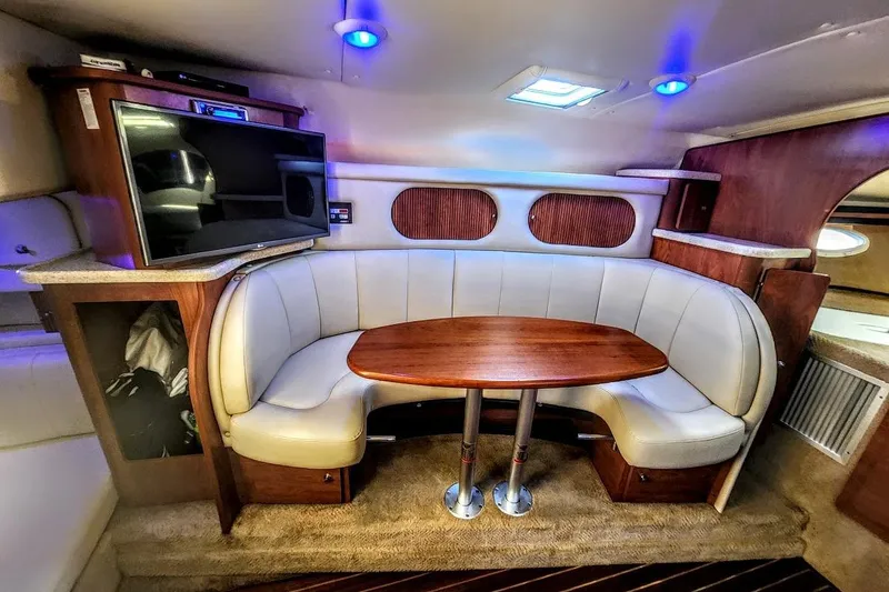 Slide: The Image of Luxurious interior of 2007 Rinker 320 Express Cruiser with cozy seating and modern amenities. - 2