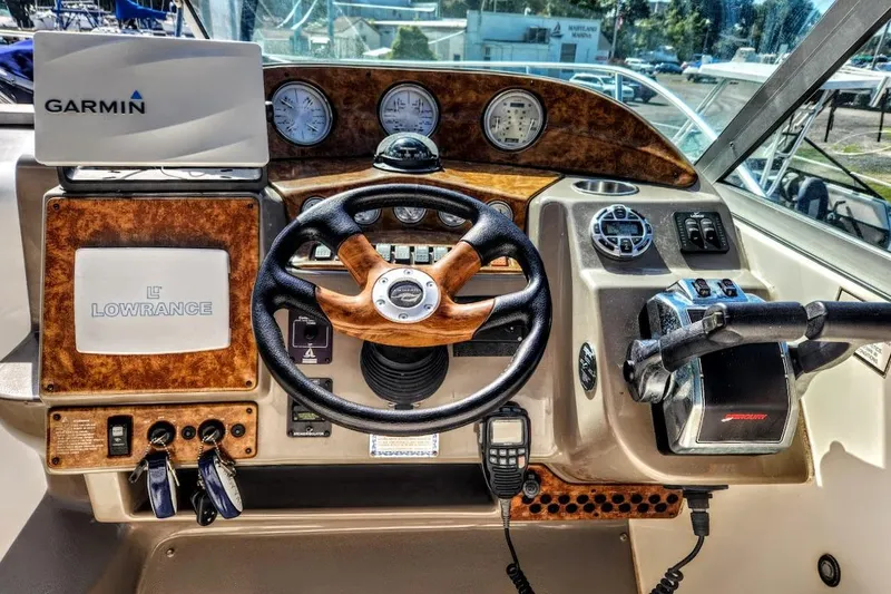 Slide: The Image of Dashboard of a 2007 Rinker 320 Express Cruiser with Garmin and Lowrance equipment. - 21