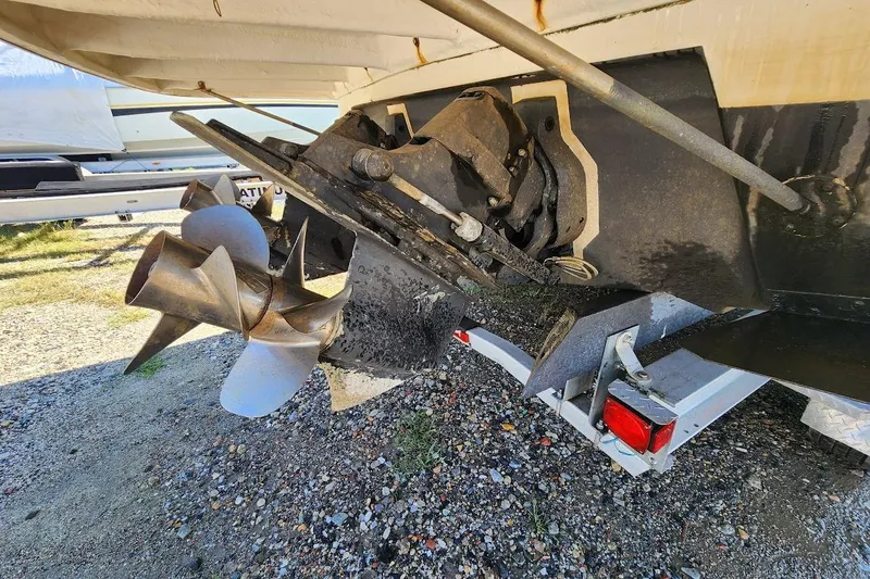 Slide: The Image of 2007 Rinker 320 Express Cruiser propeller and stern drive on trailer. - 30
