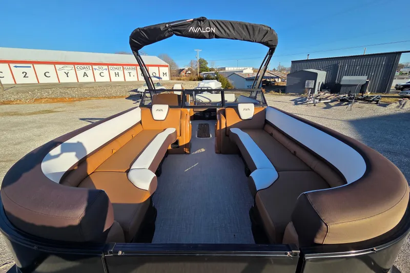 Slide: The Image of 2026 Avalon Platinum LSZ 2585 VRB boat with windshield and arch, featuring spacious seating. - 4