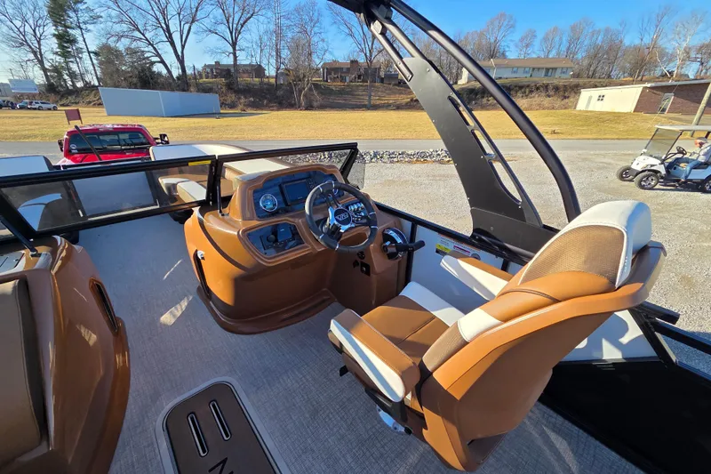 Slide: The Image of 2026 Avalon Platinum LSZ 2585 VRB boat interior with modern dashboard and comfortable seating. - 5