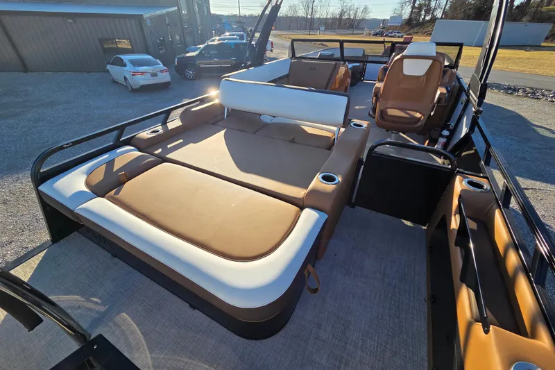 Slide: The Image of 2026 Avalon Platinum LSZ 2585 VRB boat interior with luxurious seating and cup holders. - 7