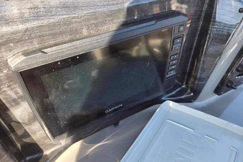Slide: The Image of Garmin display on 2023 Qwest RLS 820 boat dashboard, close-up view. - 10