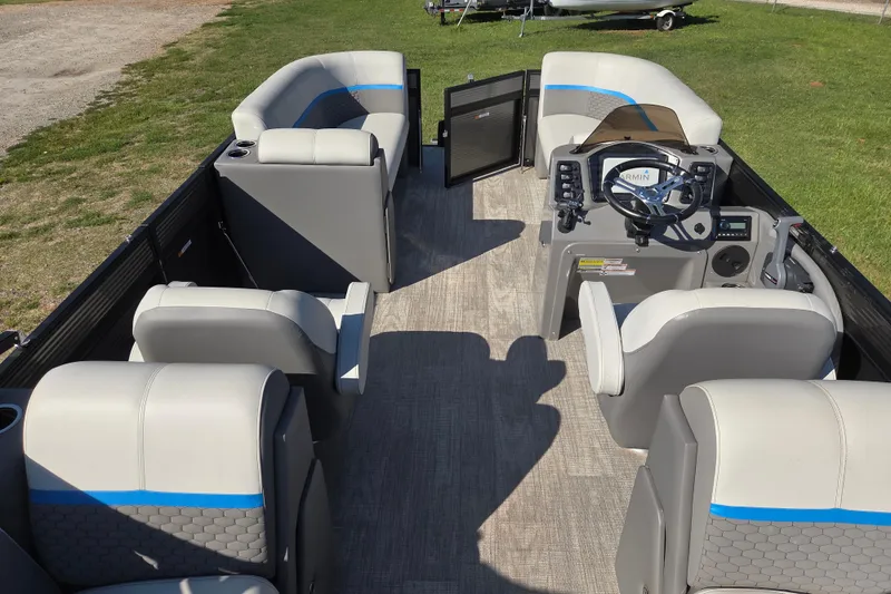 Slide: The Image of 2023 Qwest RLS 820 pontoon boat interior with modern seating and steering console. - 12