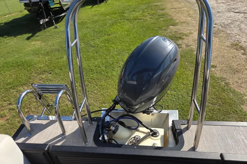 Slide: The Image of 2023 Qwest RLS 820 boat with outboard motor and stainless steel railings. - 13