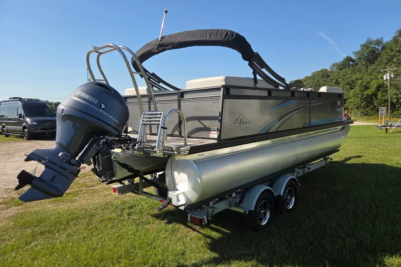 Slide: The Image of 2023 Qwest RLS 820 pontoon boat with Yamaha outboard motor on a trailer. - 4