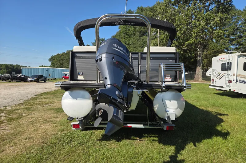 Slide: The Image of 2023 Qwest RLS 820 pontoon boat with Yamaha outboard motor, parked on grass. - 5