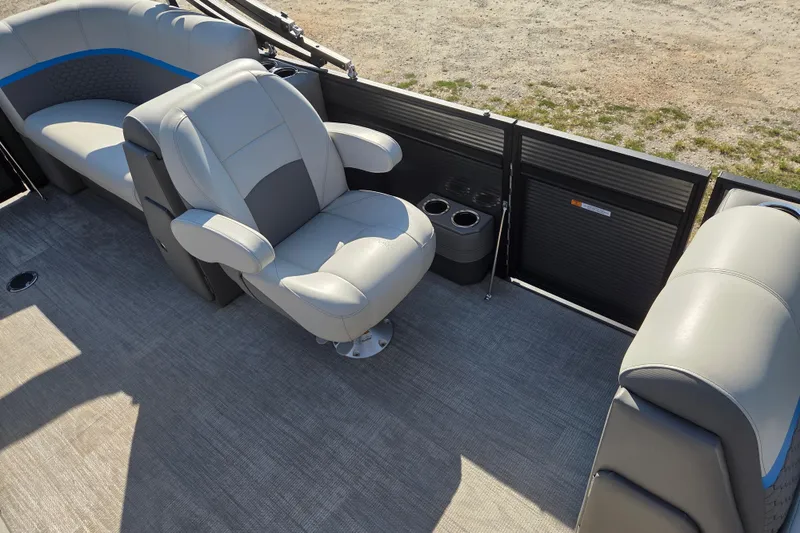 Slide: The Image of 2023 Qwest RLS 820 boat interior with gray seating and cup holders. - 8