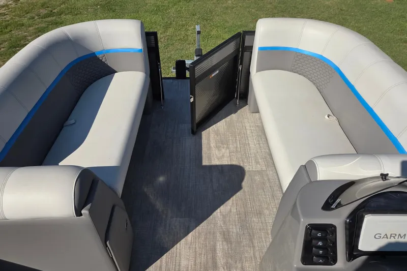 Slide: The Image of 2023 Qwest RLS 820 pontoon boat interior with gray seating and Garmin dashboard. - 9