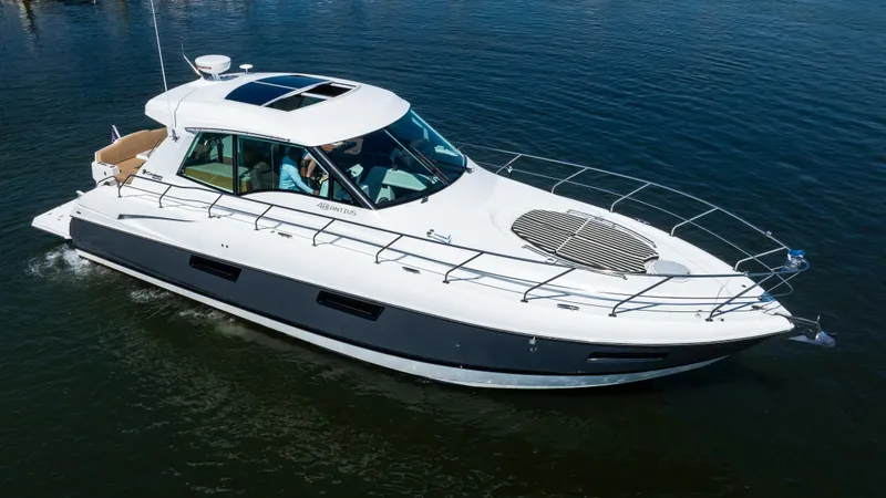 Slide: The Image of 2013 Cruisers Yachts 48 Cantius luxury boat cruising on calm water. - 1