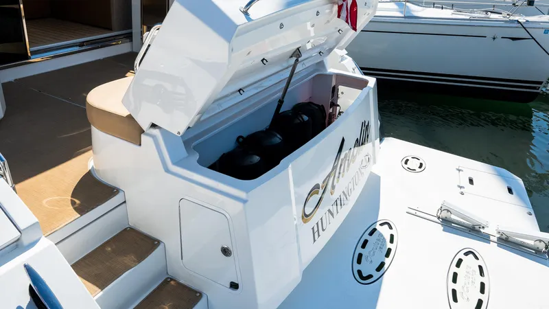 Slide: The Image of 2013 Cruisers Yachts 48 Cantius with open storage compartment on deck. - 10