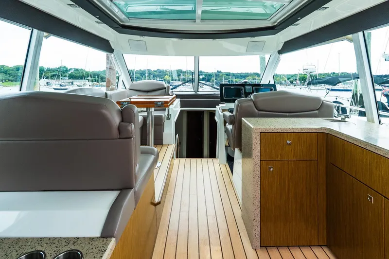 Slide: The Image of Interior of 2013 Cruisers Yachts 48 Cantius with modern helm and seating. - 18