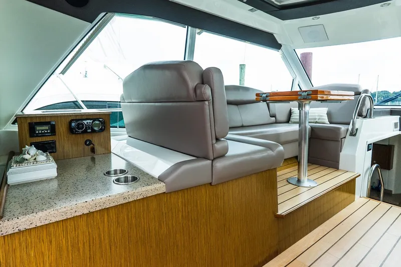 Slide: The Image of Luxurious interior of 2013 Cruisers Yachts 48 Cantius with plush seating and elegant table. - 21