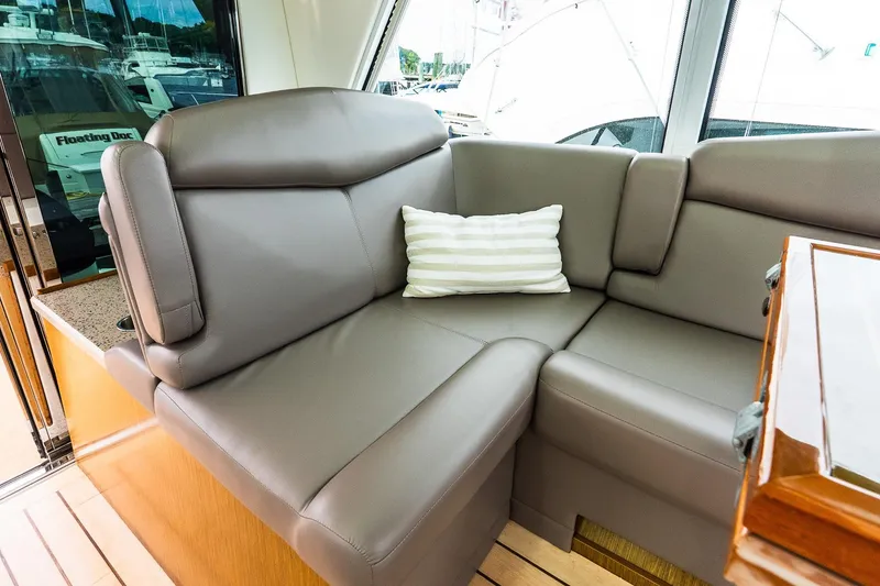 Slide: The Image of Luxurious interior seating on 2013 Cruisers Yachts 48 Cantius with striped cushion. - 22