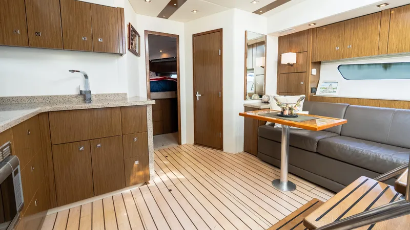 Slide: The Image of Luxurious interior of 2013 Cruisers Yachts 48 Cantius with modern kitchen and seating area. - 32