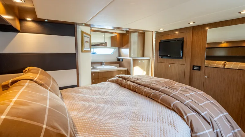 Slide: The Image of Luxurious bedroom interior of 2013 Cruisers Yachts 48 Cantius with modern amenities and cozy bedding. - 35