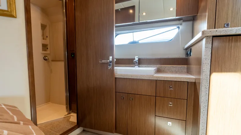 Slide: The Image of Luxurious bathroom interior of 2013 Cruisers Yachts 48 Cantius with wood cabinetry and modern fixtures. - 37