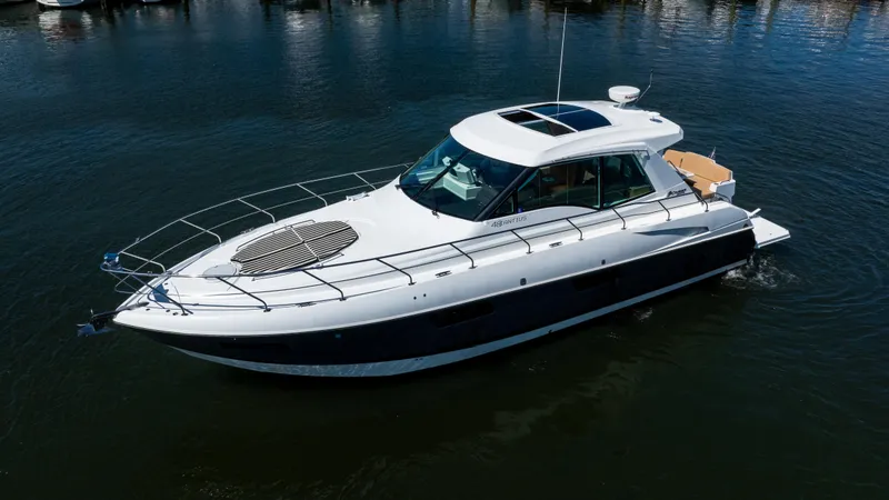 Slide: The Image of 2013 Cruisers Yachts 48 Cantius luxury boat on calm water. - 4