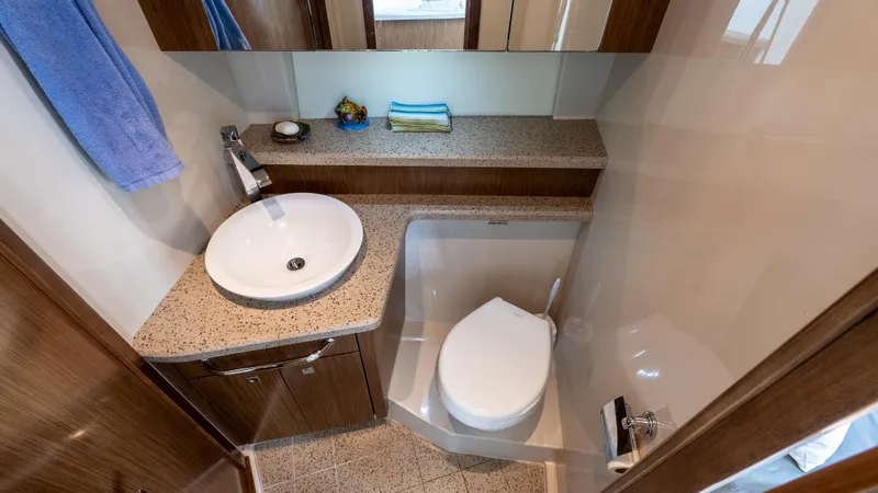 Slide: The Image of Luxurious bathroom in 2013 Cruisers Yachts 48 Cantius, featuring modern sink and toilet. - 42