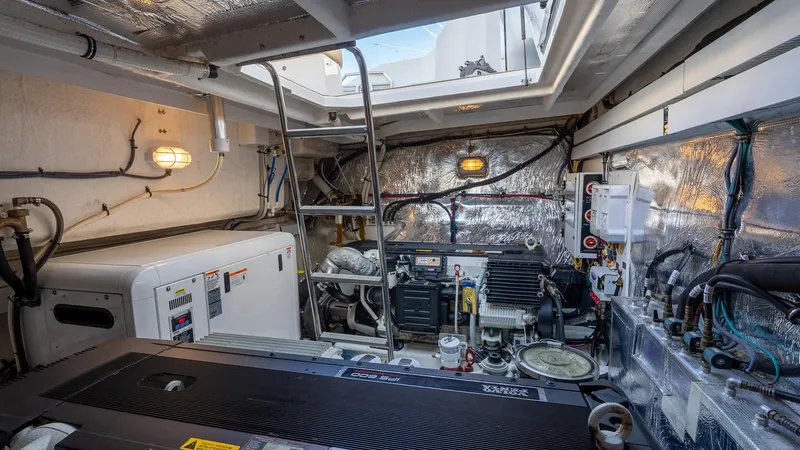 Slide: The Image of Engine room of 2013 Cruisers Yachts 48 Cantius, showcasing mechanical equipment and wiring. - 46