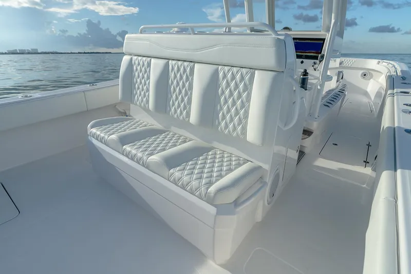 Slide: The Image of Manufacturer Provided Image: Luxurious seating on 2023 Invincible 33 Catamaran, featuring diamond-stitched upholstery. - 10