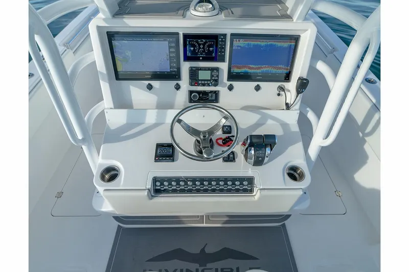 Slide: The Image of Manufacturer Provided Image: 2023 Invincible 33 Catamaran helm with advanced navigation and control systems. - 13