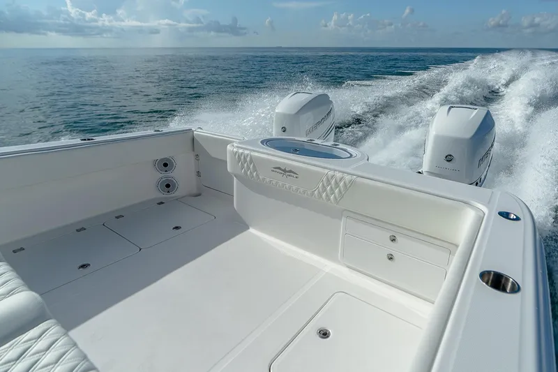 Slide: The Image of Manufacturer Provided Image: Invincible 33 Catamaran 2023 cruising on open water, showcasing sleek design and powerful engines. - 15