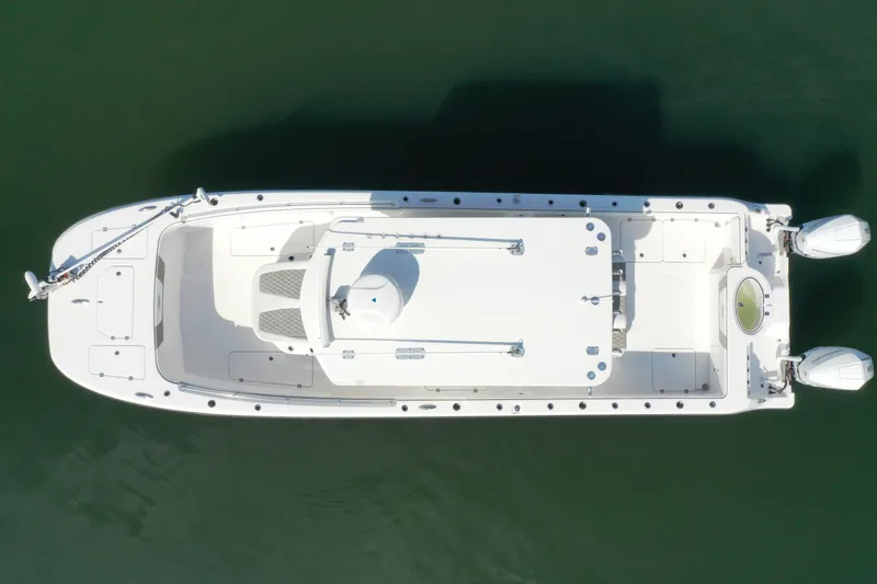 Slide: The Image of Overhead view of 2023 Invincible 33 Catamaran, showcasing sleek design and dual engines. - 14
