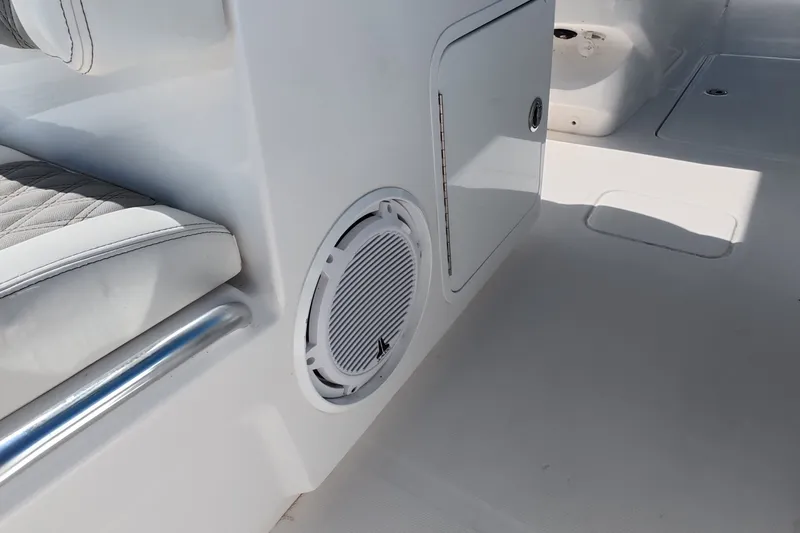 Slide: The Image of Interior of 2023 Invincible 33 Catamaran featuring seating and speaker detail. - 29
