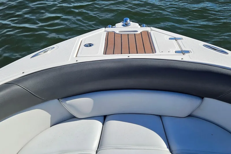 Slide: The Image of Bow seating area of 2010 Regal 2700 ES Bowrider on water. - 27