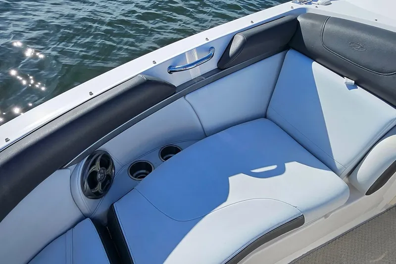 Slide: The Image of 2010 Regal 2700 ES Bowrider interior with cushioned seating and cup holders. - 29