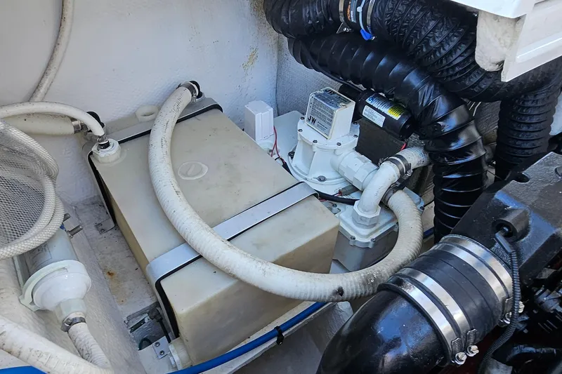Slide: The Image of Engine compartment of 2010 Regal 2700 ES Bowrider with hoses and components. - 66