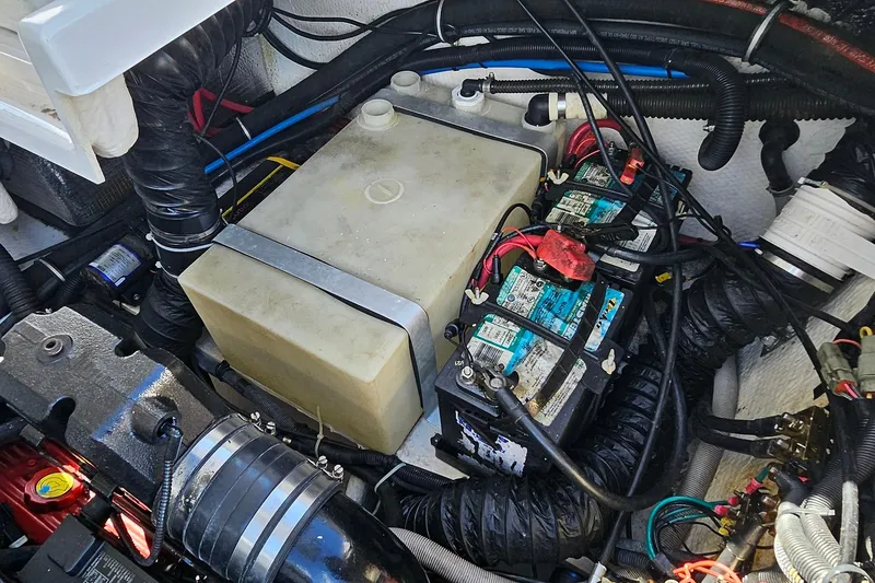 Slide: The Image of Engine compartment of 2010 Regal 2700 ES Bowrider with batteries and wiring. - 67