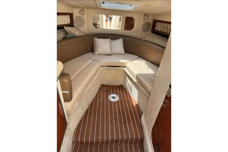 Slide: The Image of 2001 Formula 290 Sun Sport interior with microwave, TV, and sink in cabin area. - 7