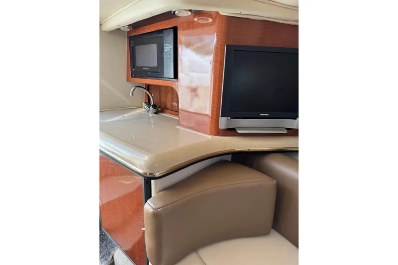 Slide: The Image of 2001 Formula 290 Sun Sport boat bathroom with toilet and sink. - 8