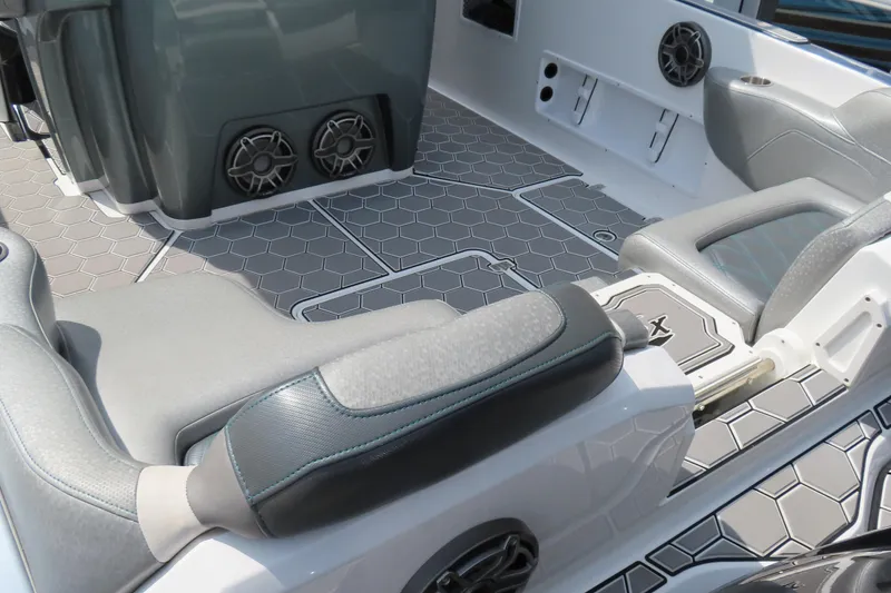 Slide: The Image of 2020 Sunsation 34 CCX boat interior with hexagonal flooring and cushioned seating. - 12