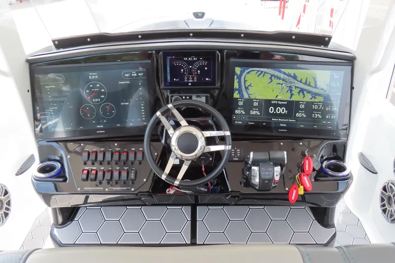 Slide: The Image of 2020 Sunsation 34 CCX dashboard with advanced navigation and control systems. - 14