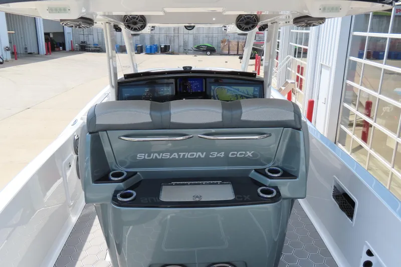 Slide: The Image of 2020 Sunsation 34 CCX boat interior with helm and seating area. - 15