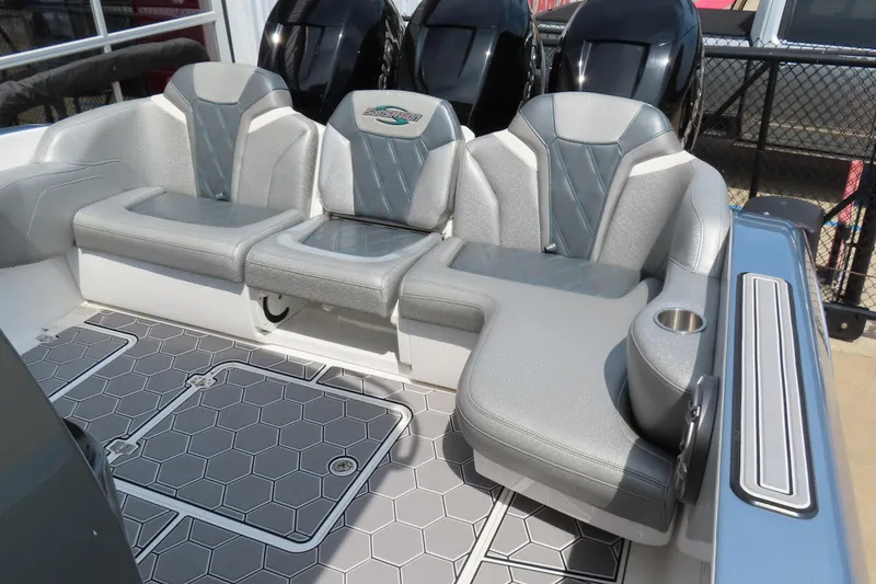 Slide: The Image of 2020 Sunsation 34 CCX boat interior with gray seating and hexagonal floor design. - 17